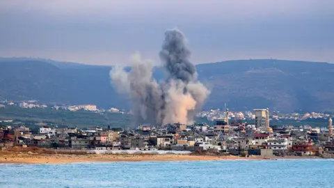 AFP Smoke rises from the site of an Israeli strike near the southern Lebanese city of Tyre (27 May 2026)