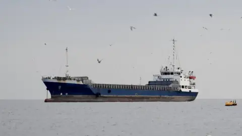 Reuters A vessel in the Strait of Hormuz