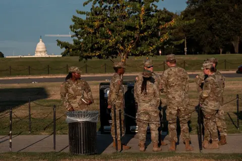 Getty Images Troops seen standing with the US Capitol building in the background
