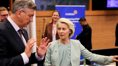 Reuters European Commission President Ursula von der Leyen speaks to Croatia's Prime Minister Andrej Plenkovic at the Cyprus summit