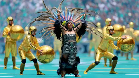 Reuters Performers during the opening ceremony before the match