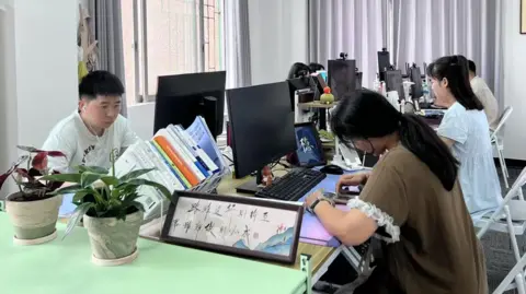 Attendees at Pretend To Work Company, in the city of Dongguan