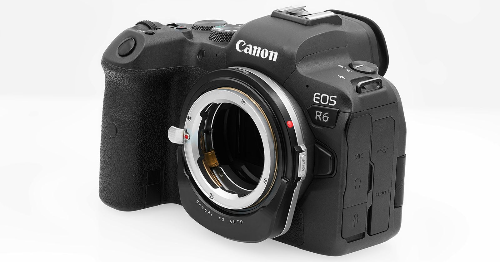 A black Canon EOS R6 digital camera body without a lens attached, showing the lens mount and various control buttons, on a plain white background.