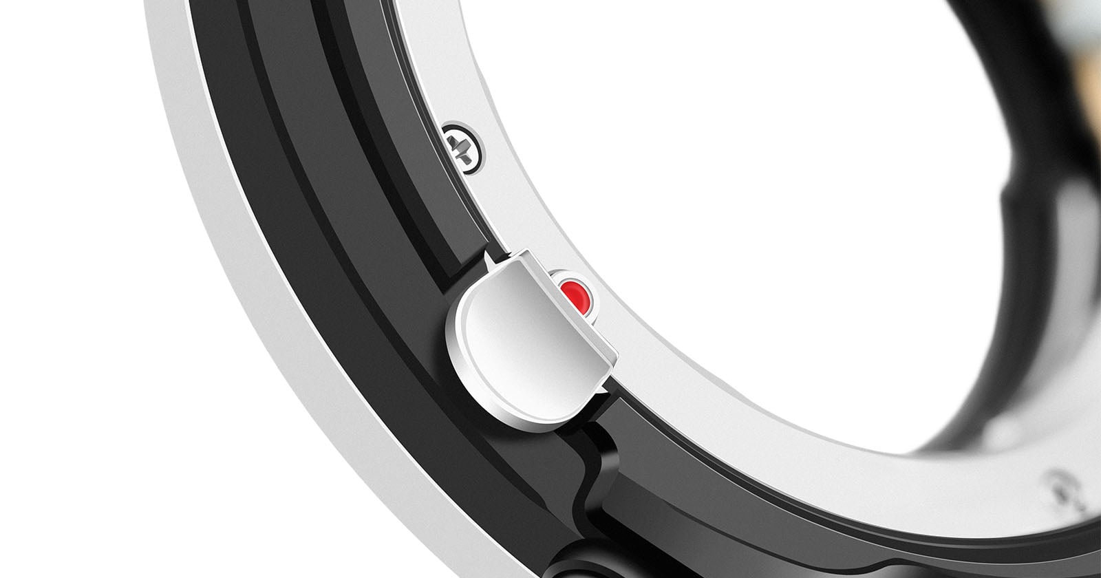 Close-up of a camera lens mount adapter showing a red alignment dot and metal contacts, with part of the locking mechanism visible. The image focuses on the details of the adapter's construction.