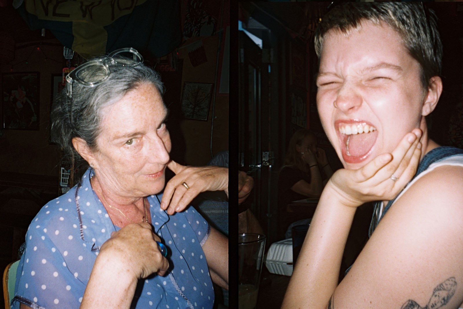 Two people pose indoors: on the left, an older woman in glasses and a sheer blue blouse smiles playfully; on the right, a younger person with short hair strikes a dramatic, open-mouthed pose while touching their face.