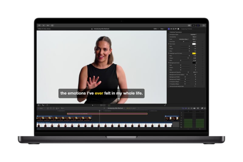 A laptop screen displays a video editing program with a woman in a black top signing and speaking on screen. Subtitles read, “the emotions I’ve ever felt in my whole life.” Editing tools and timeline are visible.