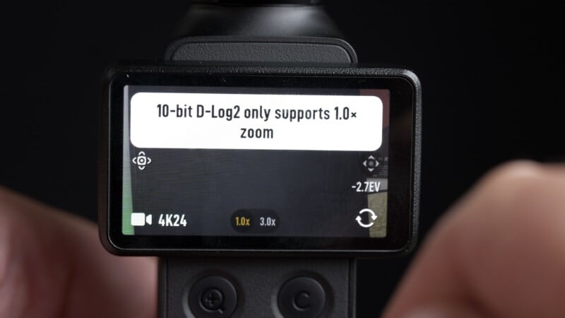 A close-up of a digital camera screen displaying a warning message that reads, "10-bit D-Log2 only supports 1.0x zoom.