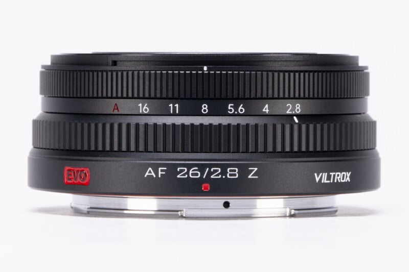 A Viltrox AF 26mm f/2.8 Z camera lens with aperture markings, a red EVO label, and a metallic mount, photographed against a white background.