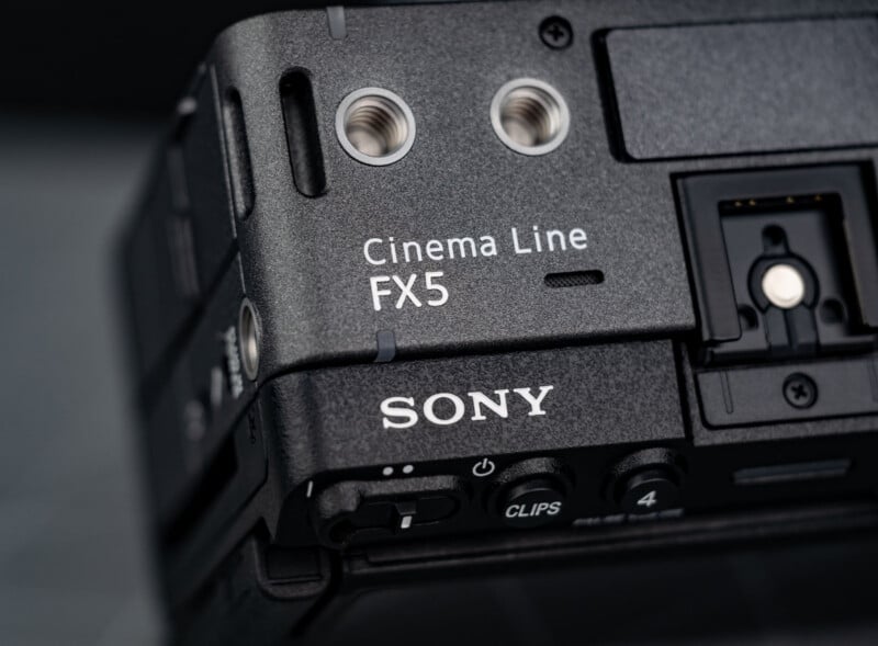 Close-up of a black Sony Cinema Line FX5 camera body, showing the brand name, model label, and part of its input ports and controls.