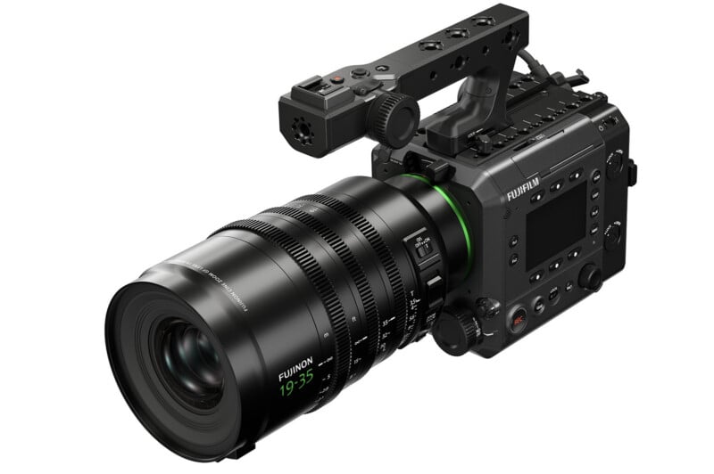 A professional digital cinema camera with a large Fujinon lens and top handle, featuring multiple control buttons and ports, designed for high-end video production.