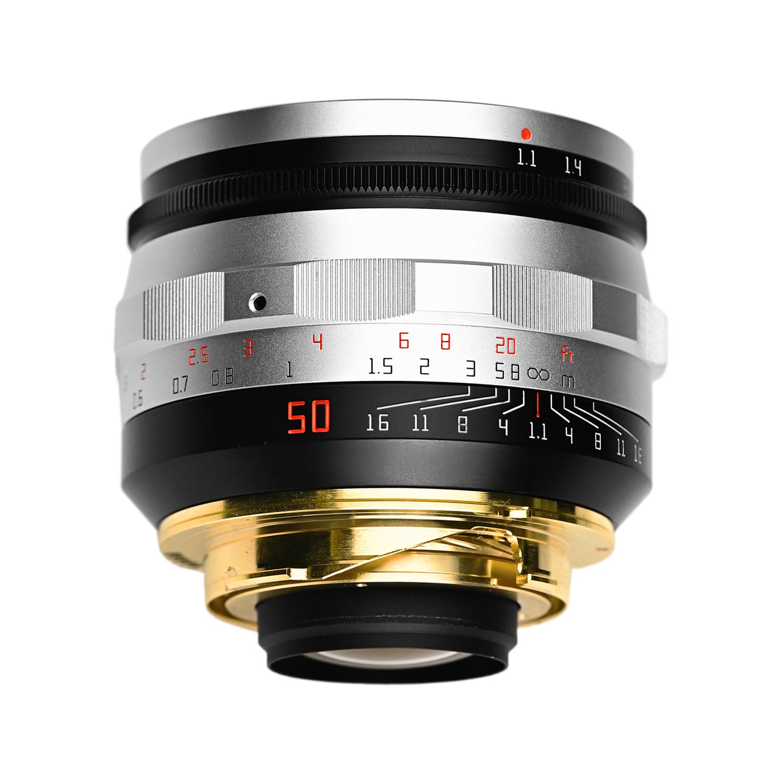 A close-up of a camera lens with a silver and black body, red and white numbers for aperture and focus distance, and a gold mounting ring.