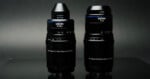 Two Laowa macro lenses stand side-by-side against a dark grey background, with the left lens labeled 5-10x and the right lens labeled 1-5x.