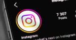 A close-up of a smartphone screen displaying the Instagram profile page, showing the app logo, the word 