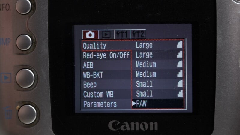 Close-up of a Canon camera screen displaying photo settings such as image quality, red-eye reduction, AEB, white balance, beep, custom white balance, and parameters set to RAW.