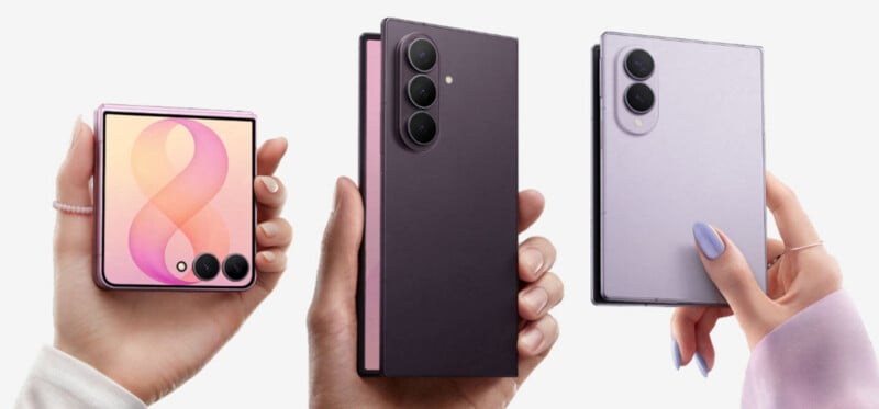 Three hands hold foldable smartphones: one pink and folded, one purple and partially open, and one lavender and fully open, all against a plain white background.