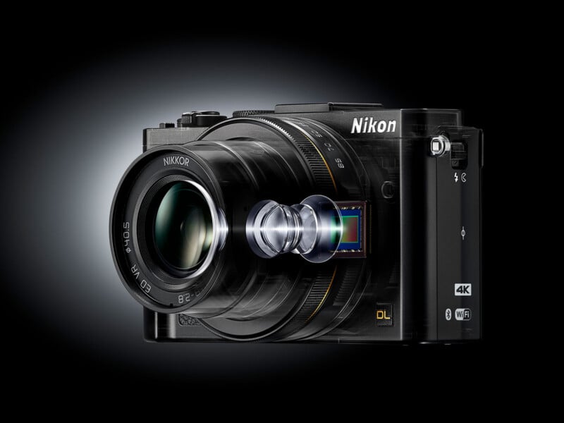A black Nikon digital camera with a visible lens assembly and image sensor, showing the internal components in a semi-transparent, exploded view style.