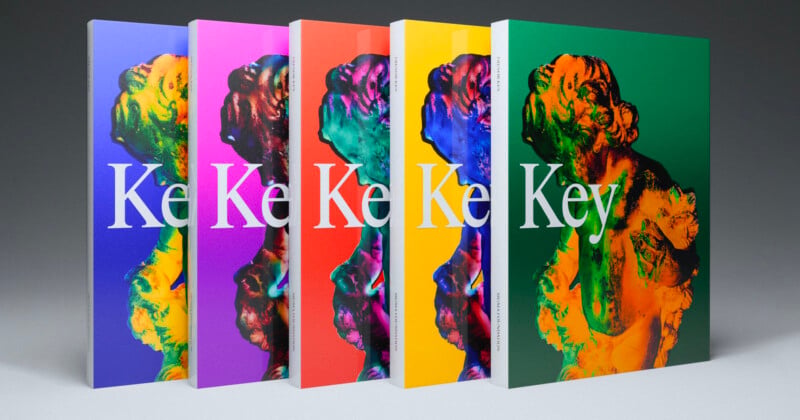 Five books stand upright in a row, each with a vibrant colored cover (blue, purple, red, yellow, green) featuring a bold 