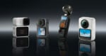 Four compact action cameras stand upright on a reflective surface, each with a display screen showing outdoor scenes. The background is dark and gradient.