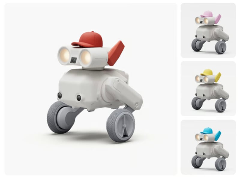Four toy-like robots on wheels, each with big round headlights, wearing different colored hats (red, pink, yellow, blue) against a white background. The largest robot is on the left; three smaller versions are on the right.