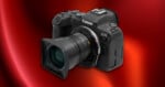 A black Canon EOS R6 camera with a wide-angle lens is shown on a shiny red gradient background.