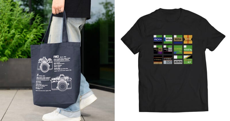 A person holds a navy tote bag with camera diagrams; next to it is a black t-shirt featuring colorful film roll labels arranged in a grid.
