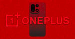 A black smartphone with dual cameras stands in front of a large red 