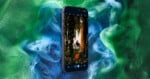 A smartphone displays a photo app with an image of a person on a rooftop, surrounded by green and blue swirling clouds in the background.