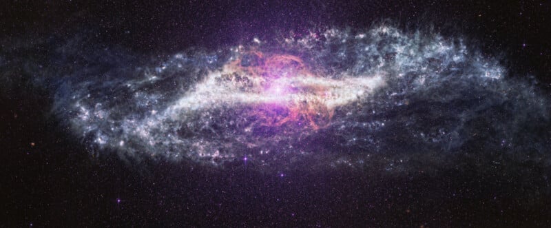 A bright, colorful galaxy with swirling clouds of purple, blue, and white dust set against a black star-filled background in space.