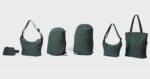 A lineup of six dark green bags, including a small waist pack, two shoulder bags, two backpacks, and a tote bag, arranged against a light gray background.