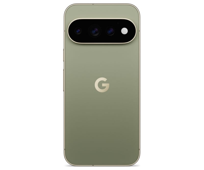 A sage green smartphone viewed from the back, featuring a horizontal, pill-shaped camera module with three lenses and a flash, and a centered "G" logo.