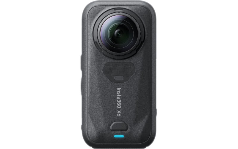 A black, rectangular 360-degree action camera with a prominent circular lens at the top, a textured body, and a small blue status light at the bottom.