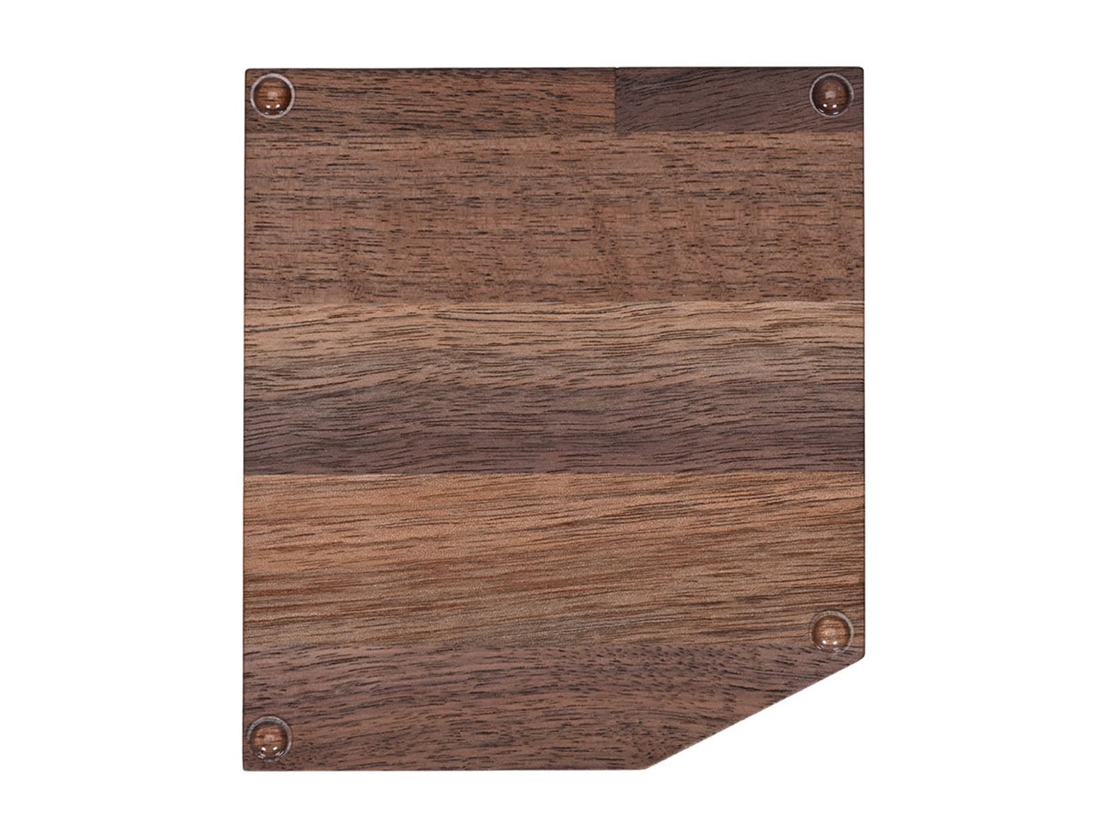 A square wooden cutting board with a beveled corner and four small, clear rubber feet on its surface.