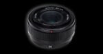 A black camera lens with a 35mm focal length, f/2.2 aperture, and 52mm filter thread, set against a solid black background.