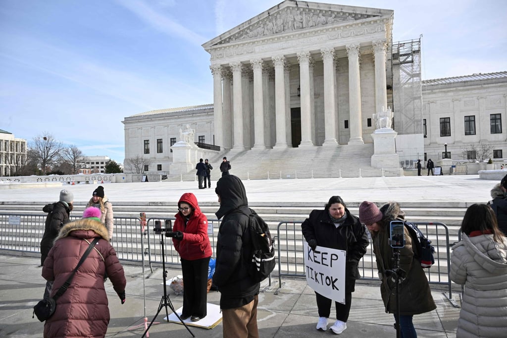 Supporters of TikTok conduct live streams in front of the US Supreme Court in Washington. Photo: AFP