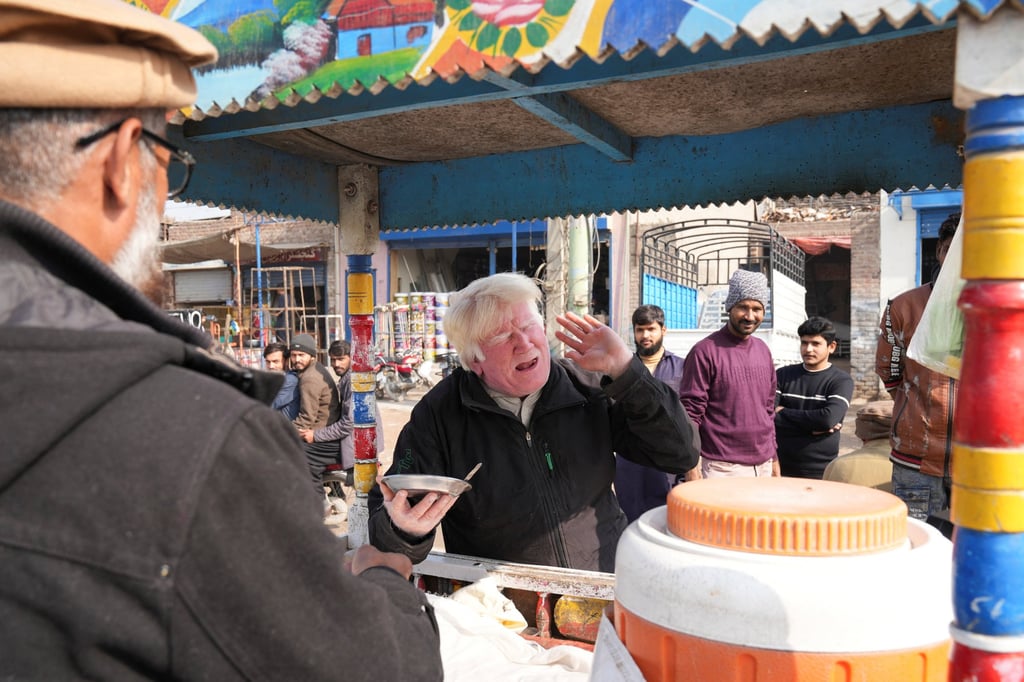 Bagga sings songs while selling kheer along a road in Sahiwal, Pakistan, on January 13, 2025. Photo: Reuters