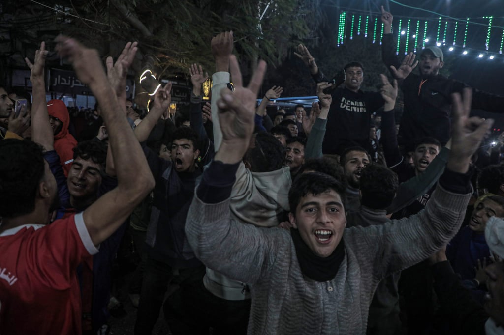 Palestinians in the central Gaza Strip react to news on the ceasefire deal on Wednesday. Photo: Xinhua