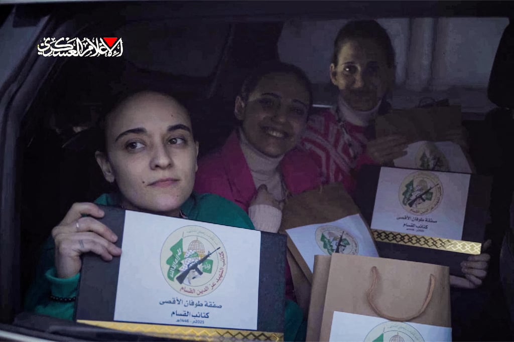 Israelis Emily Damari, Romi Gonen, and Doron Steinbrecher before they were handed over to the Red Cross on Sunday. Photo: Hamas Media Office via AFP