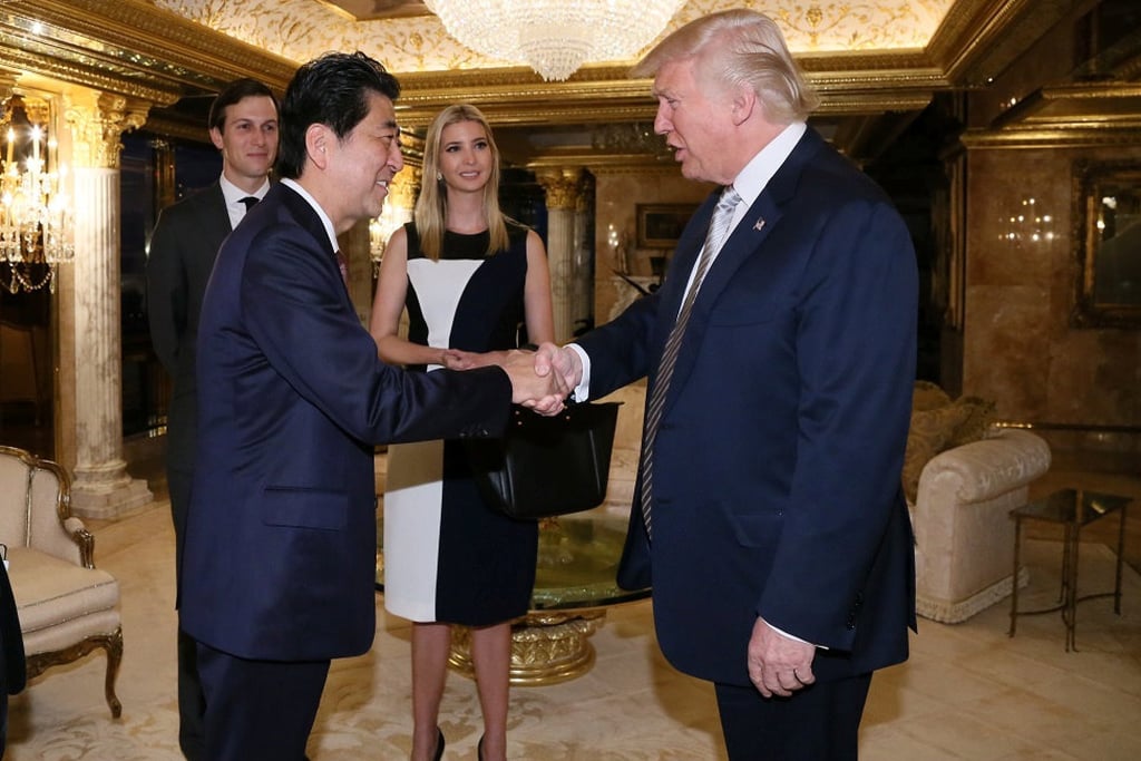 Japan’s then-prime minister, Shinzo Abe, rushed to Trump Tower to meet Donald Trump in 2016 before his first term as US president. Photo: Japan’s Cabinet Public Relations Office/Reuters
