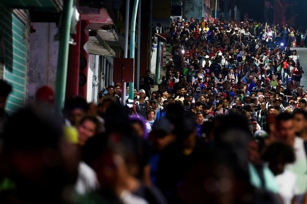 Migrants walk in a caravan bound for the northern border with the US, in Tapachula, Chiapas state, Mexico. Photo: Reuters