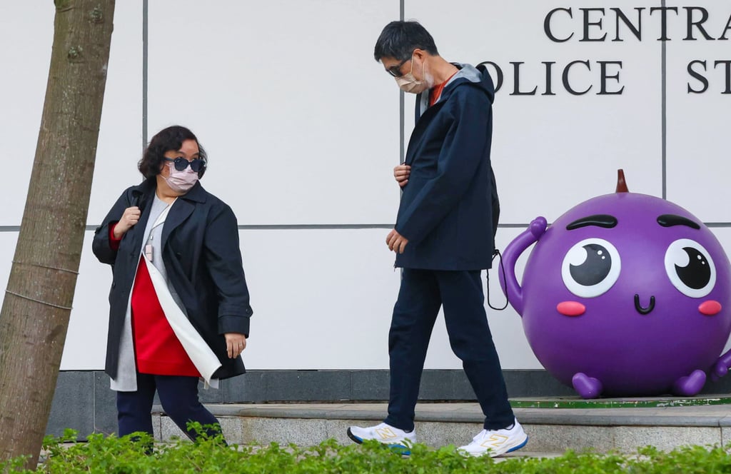 Chung Kim-wah’s sister (left) leaves the Central Police District Headquarters. Photo: handout