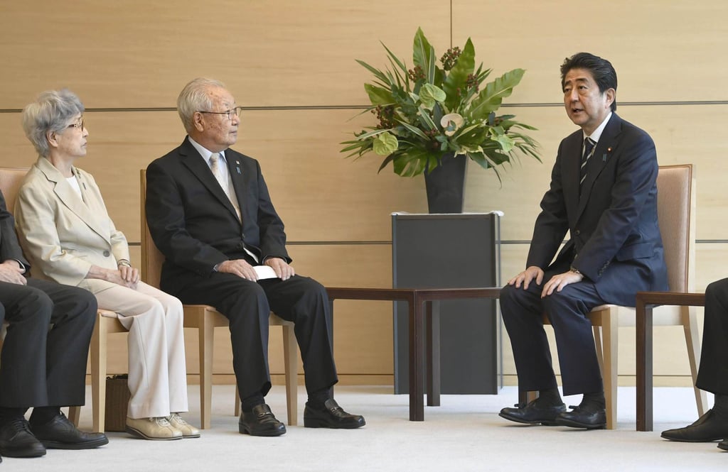 Japan’s then prime minister Shinzo Abe meets Sakie Yokota (left), whose daughter Megumi was abducted by North Korea in 1977, in 2018. Photo: Kyodo