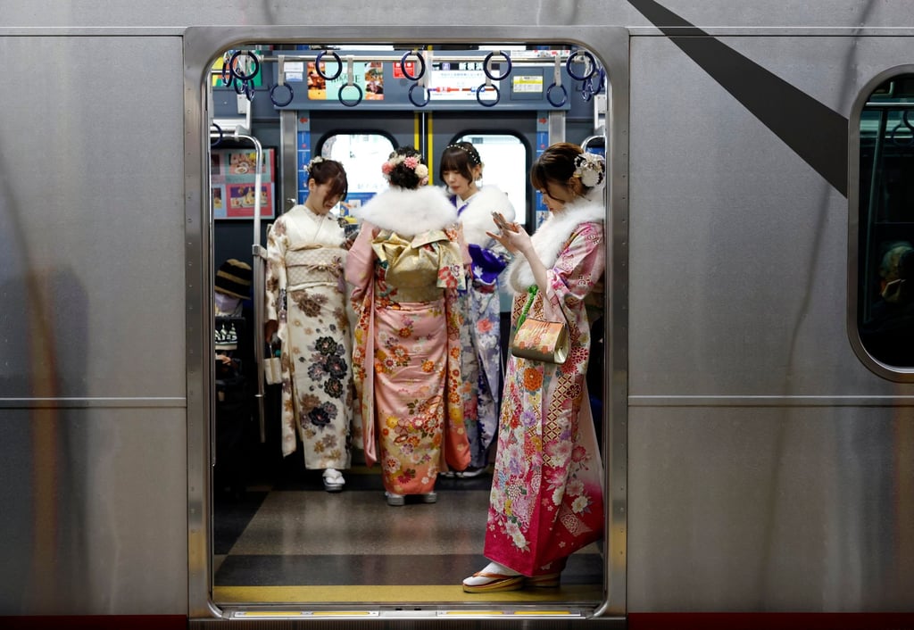 Young Japanese women wearing kimono stand in a train in Yokohama earlier this month. Police have stepped up efforts to combat “chikan” train gropers. Photo: EPA-EFE