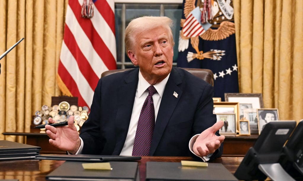 US President Donald Trump speaks to journalists about TikTok as he signs executive orders in the Oval Office of the White House in Washington on January 20, 2025. Photo: Pool/AFP/Getty Images/TNS