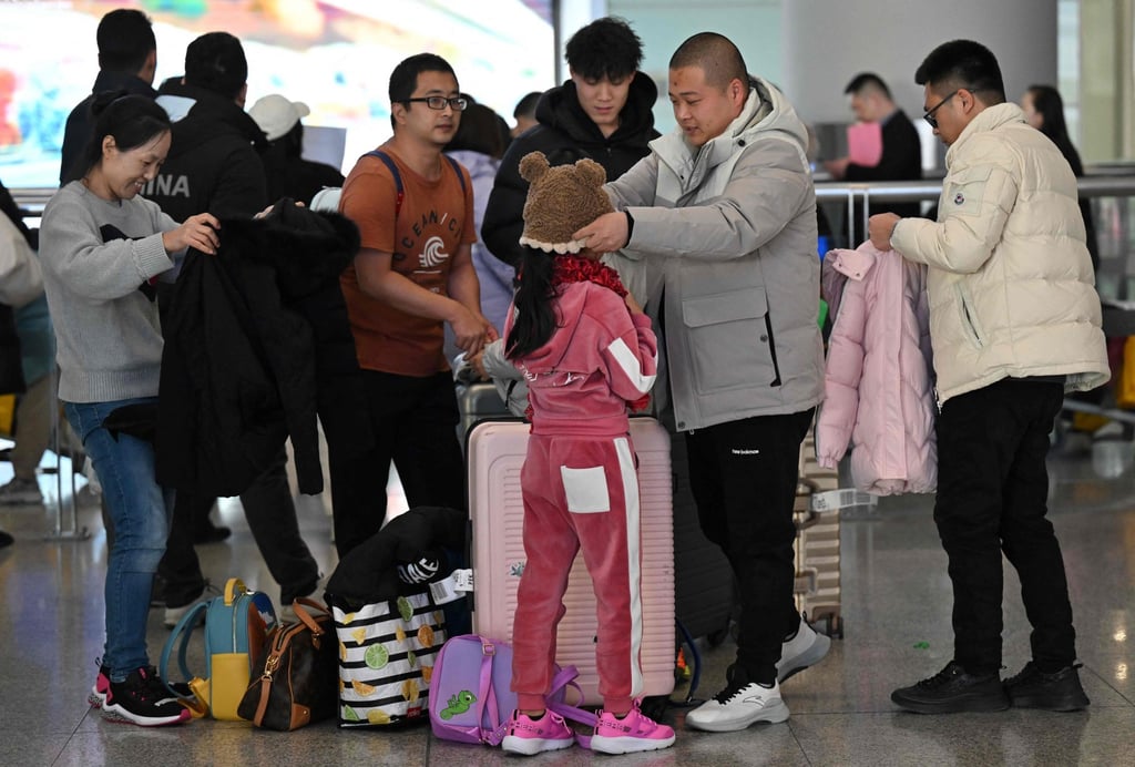 Travellers at Beijing Capital International Airport. Photo: AFP