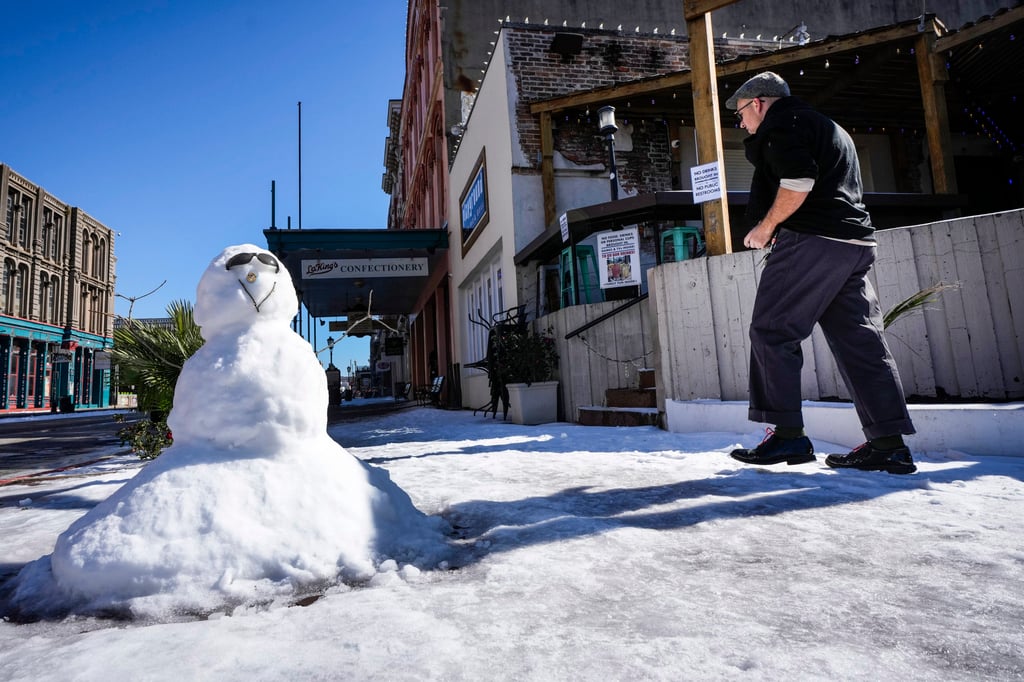 A snowman is seen on Wednesday in the aftermath of an icy winter storm in Galveston, Texas. Photo: Houston Chronicle via AP
