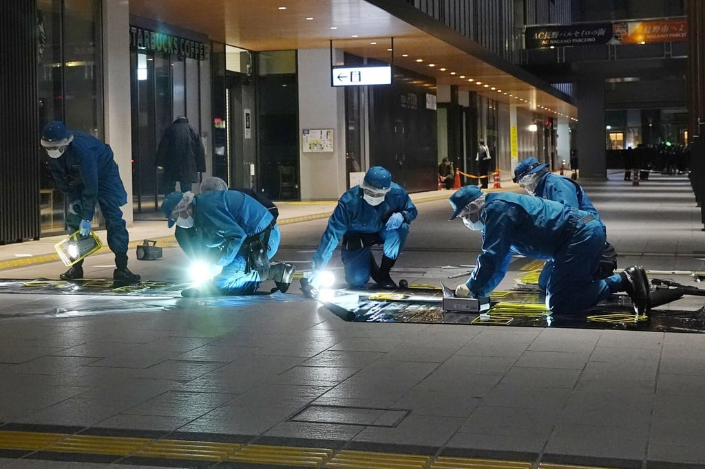 Police officers investigate the site of an apparent random stabbing near JR Nagano Station in the central Japan city of Nagano. Photo: Kyodo