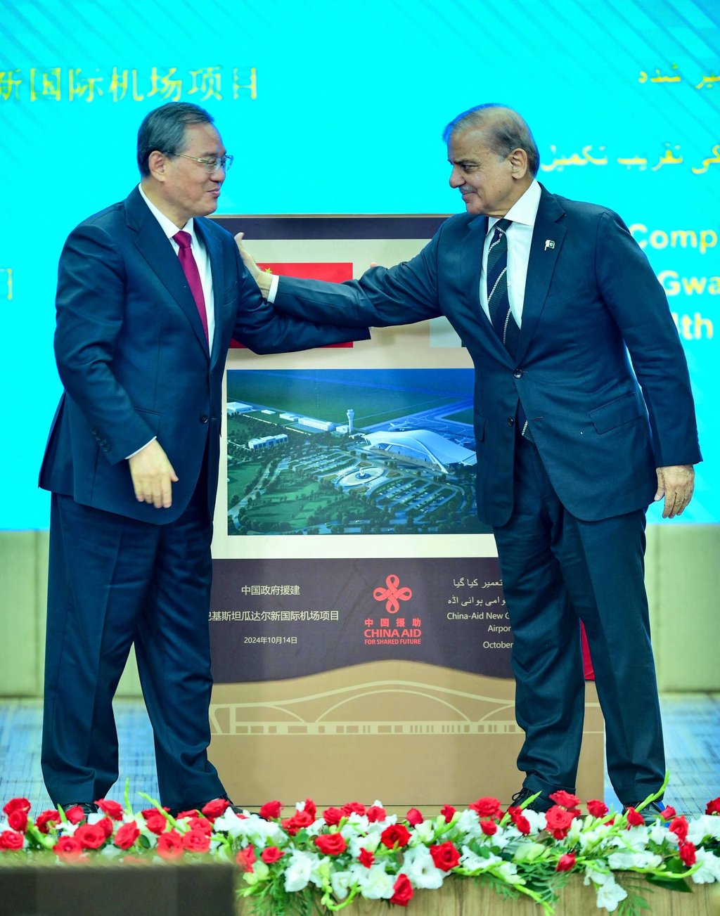 China’s Premier Li Qiang (left) and Pakistan’s Prime Minister Shehbaz Sharif gesture after unveiling a plaque to mark the completion of New Gwadar International Airport on October 14, 2025. Photo: Pakistan’s Prime Minister Office/AFP