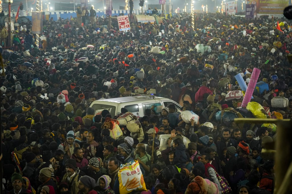 An ambulance moves in the middle of a crowd of Hindu devotees gathered for a holy dip during the Maha Kumbh festival in Prayagraj, Uttar Pradesh, on Wednesday. Photo: AP
