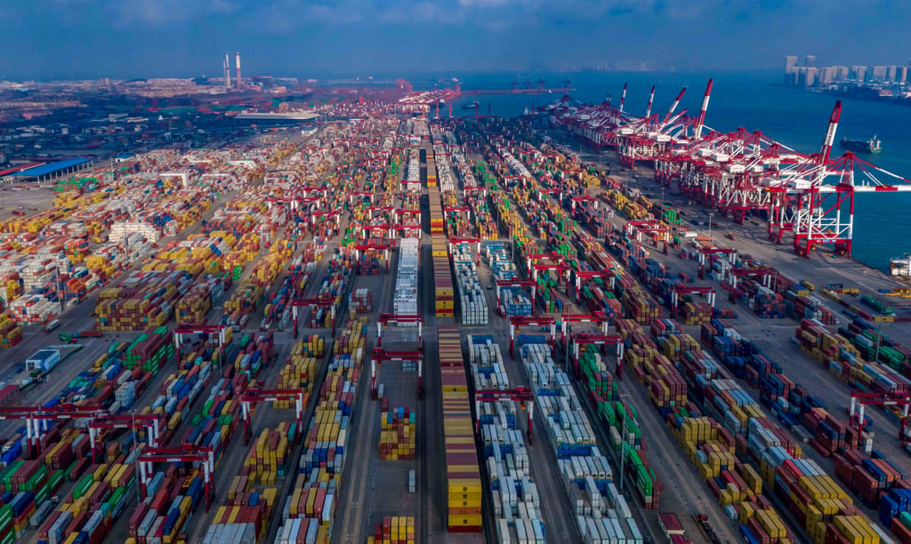 Ships are loaded at the container terminal of the port in Qingdao, in China’s eastern Shandong province on January 25, 2025. Photo: AFP