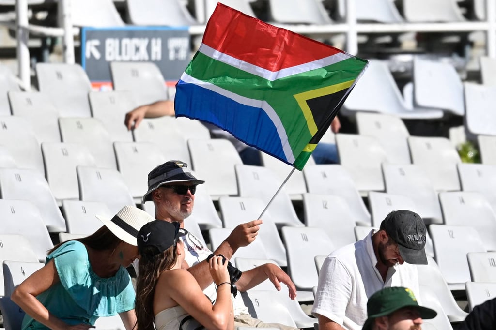 A supporter waves a South African flag during a cricket match between South Africa and Pakistan in Cape Town last month. Photo: AFP